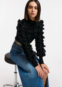 Pull en tricot noir à volants Essentiel