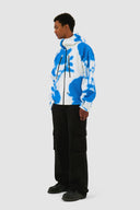 Veste technique à fleurs bleues