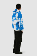 Veste technique à fleurs bleues