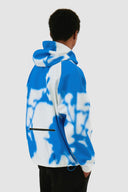 Veste technique à fleurs bleues