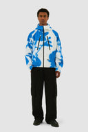 Veste technique à fleurs bleues