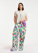 Pantalon large à imprimé fleuri blanc cassé, rose et bleu Essentiel