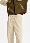 pantalon Essentiel fuselé en velours blanc cassé